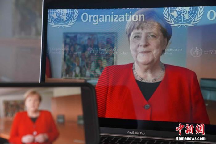 资料图：5月18日，第七十三届世界卫生大会以视频会议形式举行开幕式。图为在德国柏林拍摄的德国总理默克尔远程致辞画面。中新社记者 彭大伟 摄