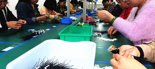 今年初,清泉社区利用一套86平方米的闲置房屋成立起电子产品有限公司