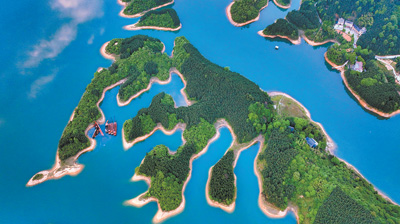 位于湖南省常宁市洋泉镇的洋泉水库，风光秀美，绿色发展推动生态惠民。刘东华摄（影像中国）