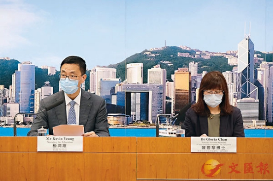 杨润雄(左)资料图(图片来源：香港《文汇报》)