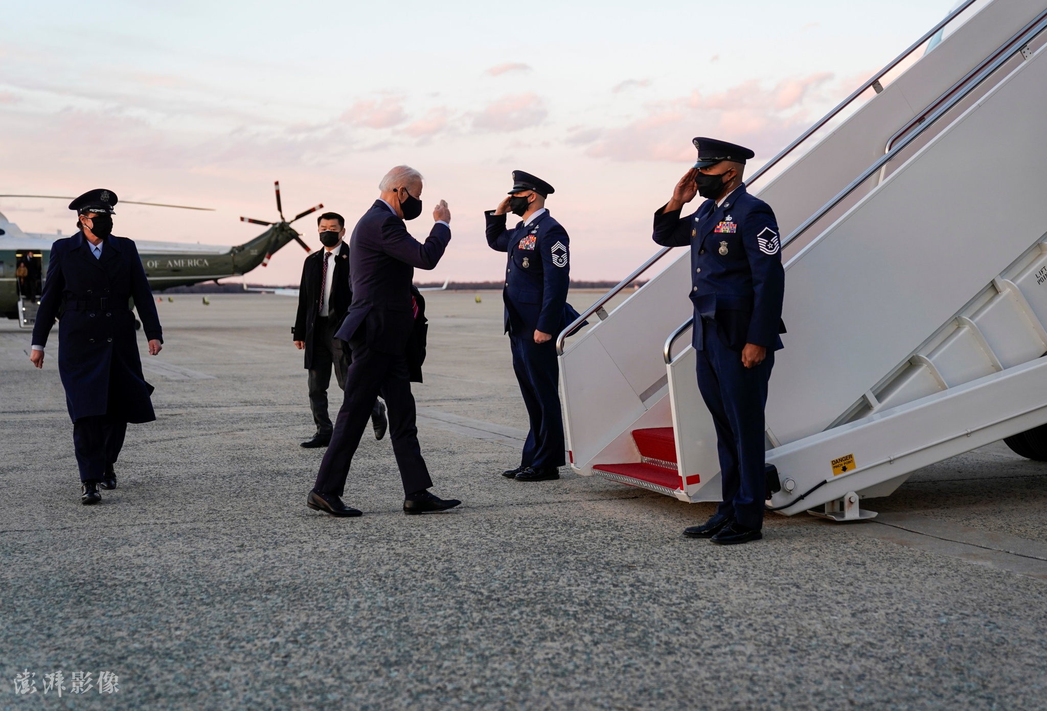 Biden almost trips up Air Force One stairs, avoids falling this time